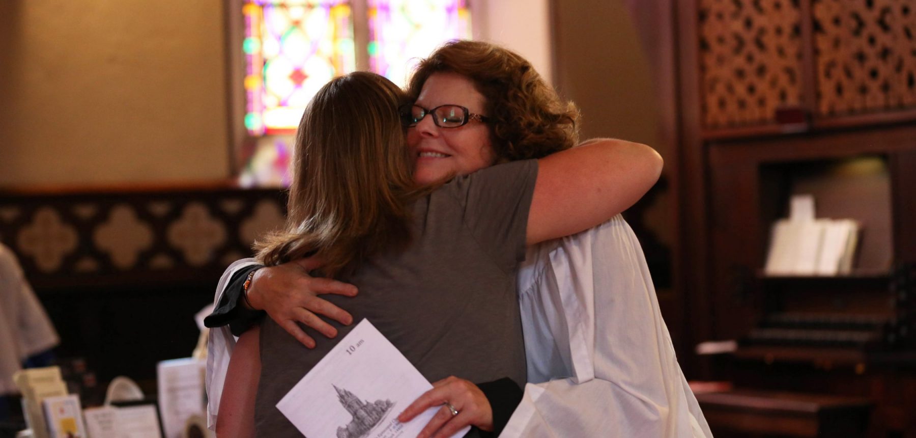 Members of the congregation sharing fellowship